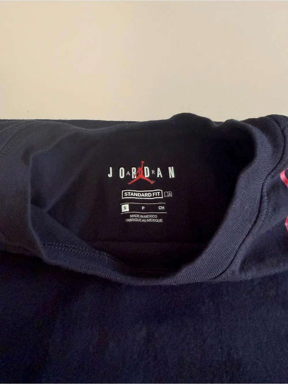 Jordan Men’s Black T‑Shirt with Red and White Sneaker Graphic